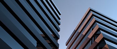 high rise buildings against blue sky