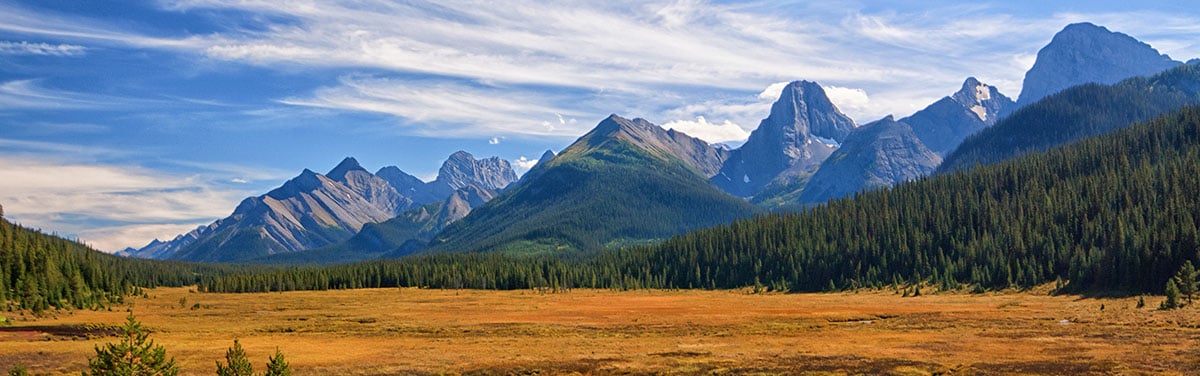 mountain range underneath a blue sky