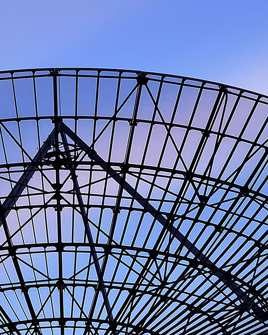 large satellite dish against a blue sky